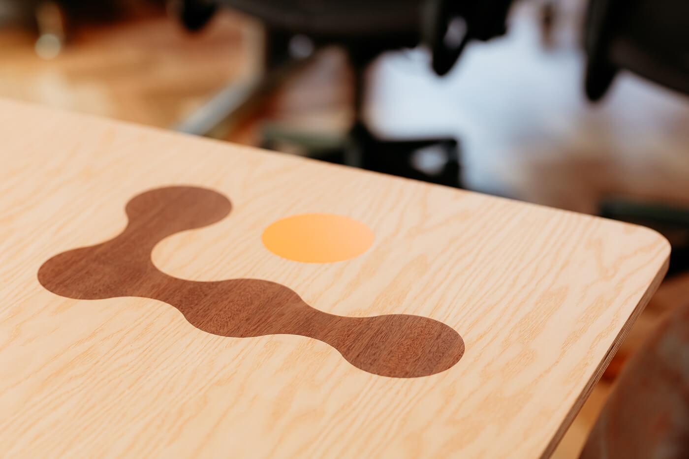Close up of the Focal Point logo embed onto a desk